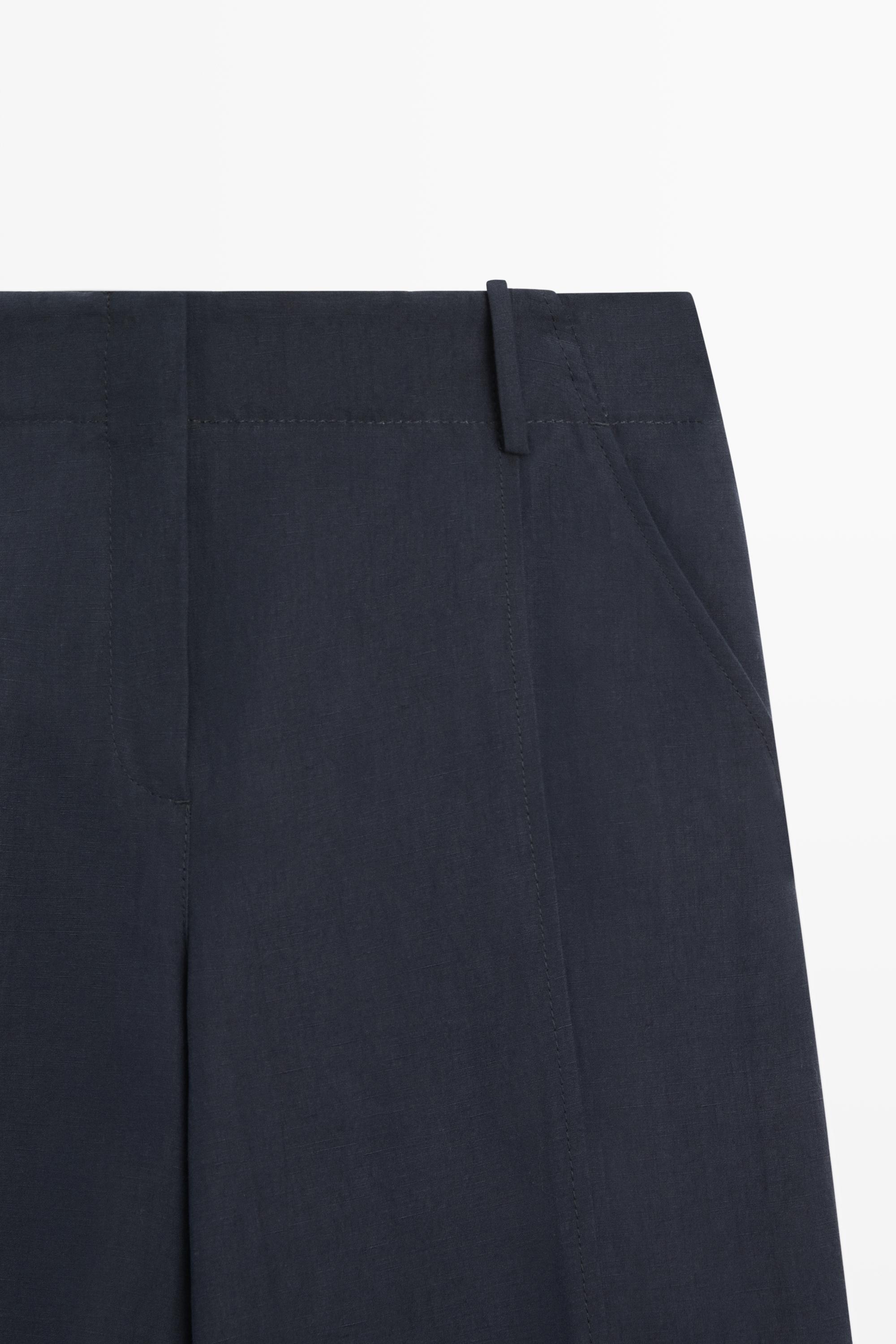 Flowing linen blend pants with buttoned tab detail